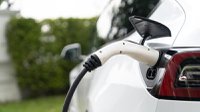 closeup-ev-charger-plug-handle-attached-electric-vehicle-port-synchronos.jpg