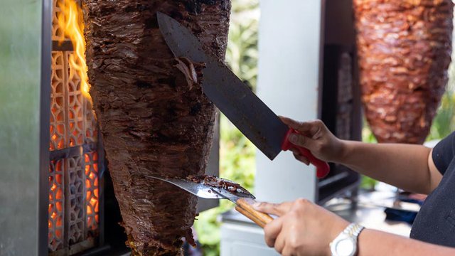 close-up-mexican-taquero-cutting-pastor-meat-center-mexico-city.jpg